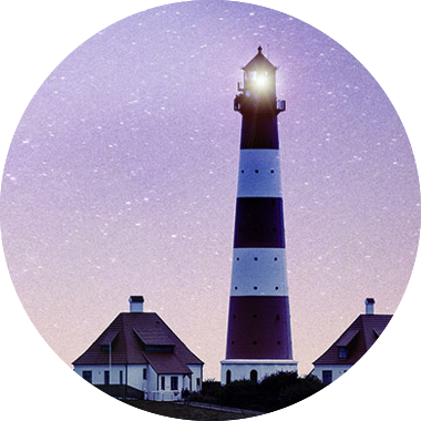 Elibrary image: lighthouse with background of stars at dawn